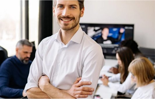 a man standing in an office 7792811