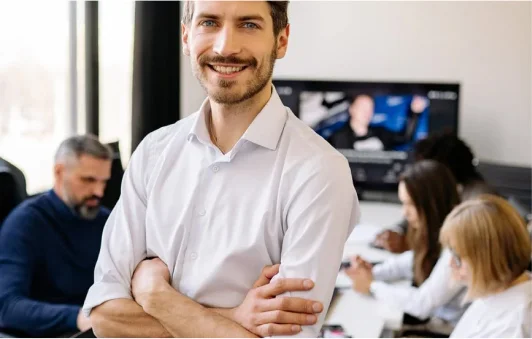 A Man Standing In An Office 7792811